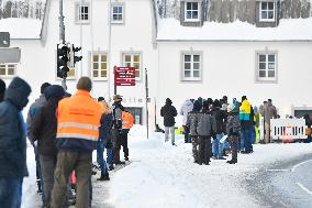 queue of commuters waiting for mandatory coronavirus tests in Bayerisch Eisenstein