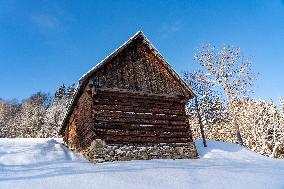 old wooden houses in winter time.