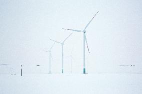 Illustration; wind turbine; renewable energy; climate change; snow; winter
