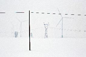 Illustration; wind turbine; renewable energy; climate change; snow; winter