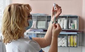 Vaccination of seniors against coronavirus, Czech Republic, ampoule, syringe, nurse, AstraZeneca