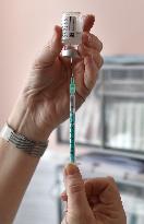 Vaccination of seniors against coronavirus, Czech Republic, ampoule, syringe, AstraZeneca