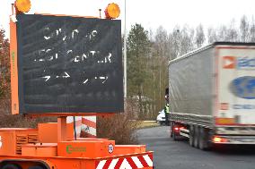 light board shows the direction to the COVID-19 test center, coronavirus, lorry, border crossing