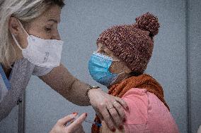 Vaccination of seniors against coronavirus, Czech Republic, syringe, senior
