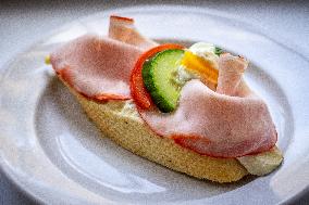 open sandwich, plate, ham, vegetable.