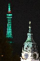 Petrin Tower is green illuminated to celebrate St. Patrick's Day in Prague