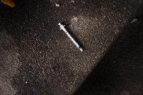 the tossed out drug addicts syringe needle