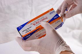 Favipiravir, drugs, box, unregistered drug, hands in gloves.