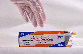 Favipiravir, drugs, box, unregistered drug, hands in gloves.