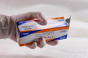 Favipiravir, drugs, box, unregistered drug, hands in gloves.