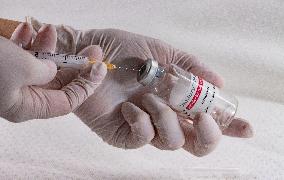 Remdesivir, Veklury, drugs, syringe, hands in gloves.