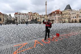 Sprayed orange words For incapable government's victims Old Town Square, Prague