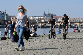 People, River Vltava embankment, Prague, Prague Castle, face mask, cyclist