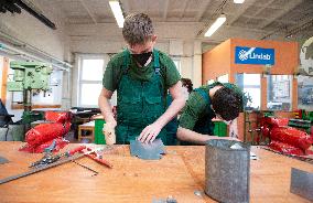 Practical lessons, students, young people, secondary schools, plumber