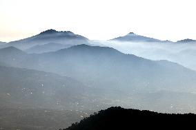 Morning Mist Wraps Around Mengshan Mountain