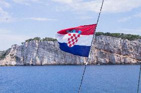 Kornati Islands National Park, The Kornati archipelago, sailing yacht, cruising, cruiser, sea, Croatian flag