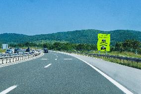 A1 motorway direction from the coastline, notice board DRZITE RAZMAK, KEEP DISTANCE, highway, low traffic, rideable, almost empty