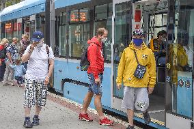 Public transport Ostrava, tram, people, face mask