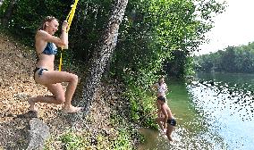 flooded quarry, woman, girl, water, summer, heat, swimsuit