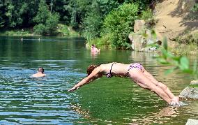 flooded quarry, water, summer, heat, swimsuit, swimming
