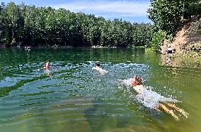 flooded quarry, water, summer, heat, swimming