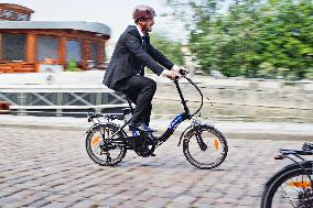 electric bike, electric powered bicycle, e-bike, cyclist, man, suit