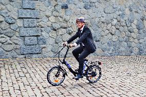 electric bike, electric powered bicycle, e-bike, cyclist, man, suit