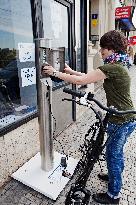 electric bike, electric powered bicycle, e-bike, charging station, woman, cyclist