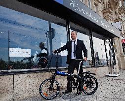 electric bike, electric powered bicycle, e-bike, charging station, cyclist, man, suit