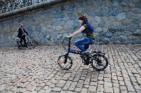 electric bike, electric powered bicycle, e-bike, cyclist, man, suit, woman, cyclists