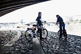 electric bike, electric powered bicycle, e-bike, cyclist, woman, Vltava river, cyclists