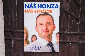 Jan Grois with writing OUR HONZA OUR SENATOR poster for senate elections
