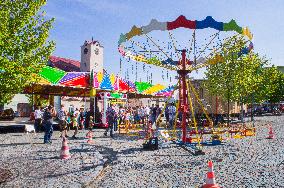 Strazov Town Hall, a fair with chain carousel and bumper cars