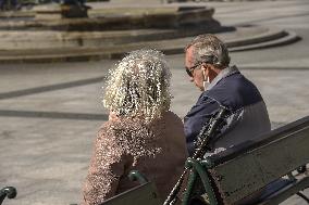 Seniors enjoy sunny weather , couple