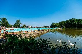 Natural swimming pool in Osek, sunny weather