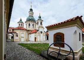 The Shrine of Our Lady Victorious at White Mountain in Prague, people, nun, mass