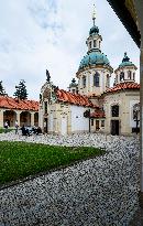 The Shrine of Our Lady Victorious at White Mountain in Prague, people, nun, mass