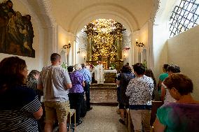 The Shrine of Our Lady Victorious at White Mountain in Prague, people, nun, mass