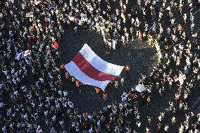 Crowds in Prague, express solidarity with Belarusian protest, people, rally, banners, Old Town Square, flag, heart