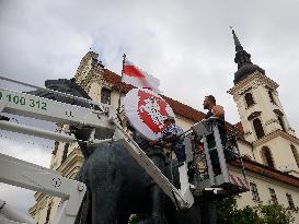 Flag and State Emblem od Belarus on the statue of Moravian Margrave Jost, Brno