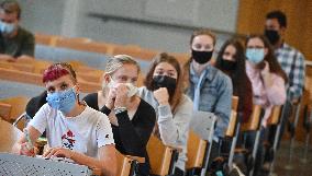 students with protective face masks, mask