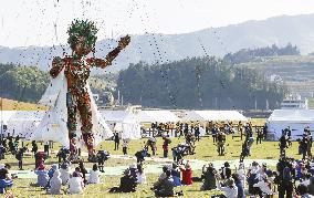 Giant puppet appears at Olympics cultural event in tsunami-hit city