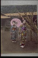 Girls taking a walk in a garden