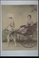 Jinrikisha puller with tattoo marks and a woman passanger