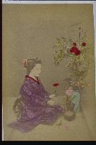 A woman arranging flowers