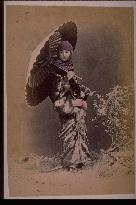 A girl holding an umbrella