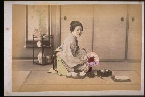 Woman resting in chanoma,a living room