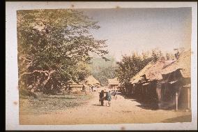 Kago,a palanquin,going along a road