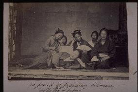 Women relaxing with tea and tobacco