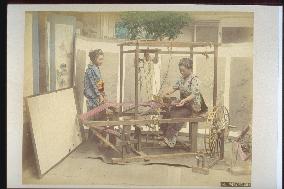 Woman weaving silk